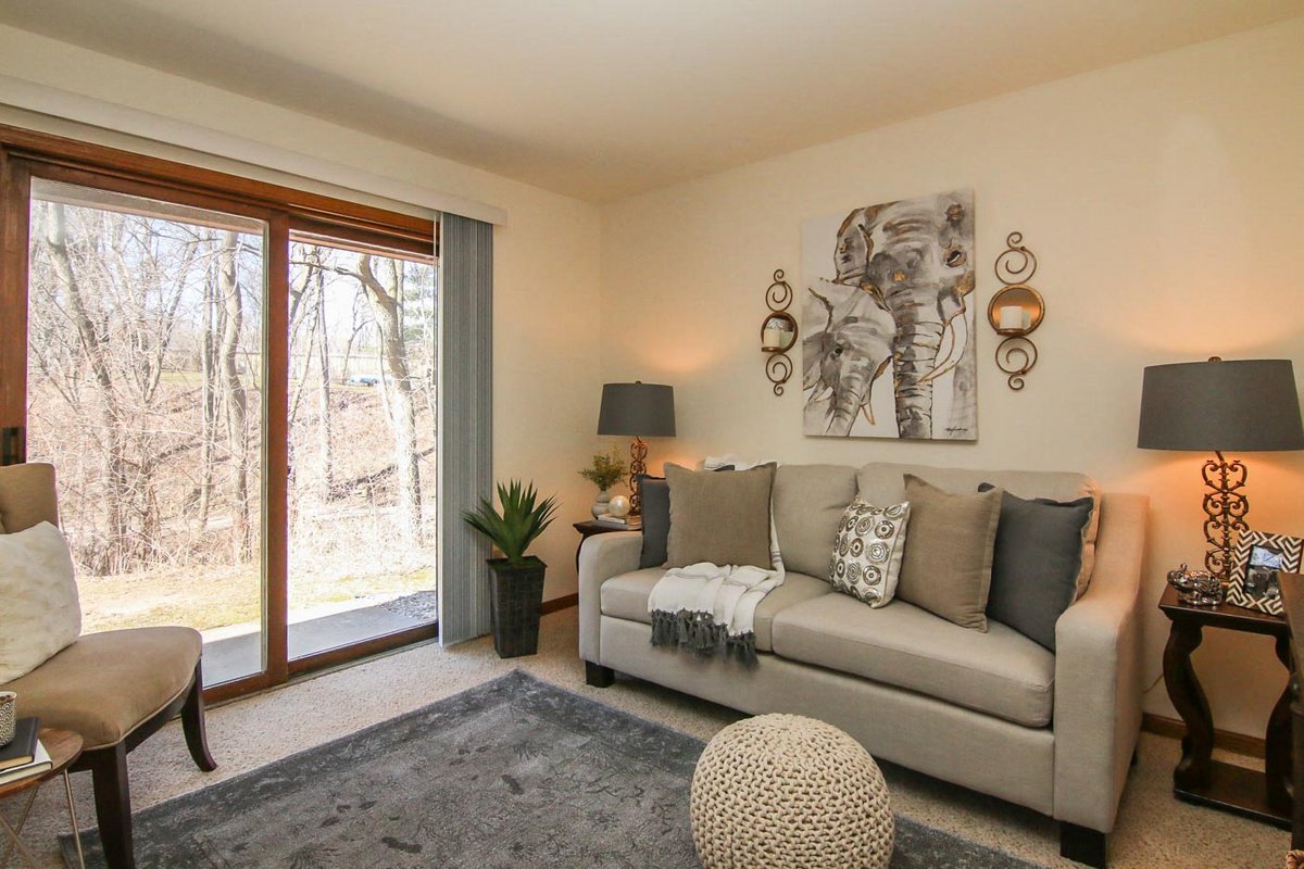 a living room with a couch and a window